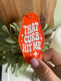 Sarcastic “That Curb Hit Me” Motel Keyring