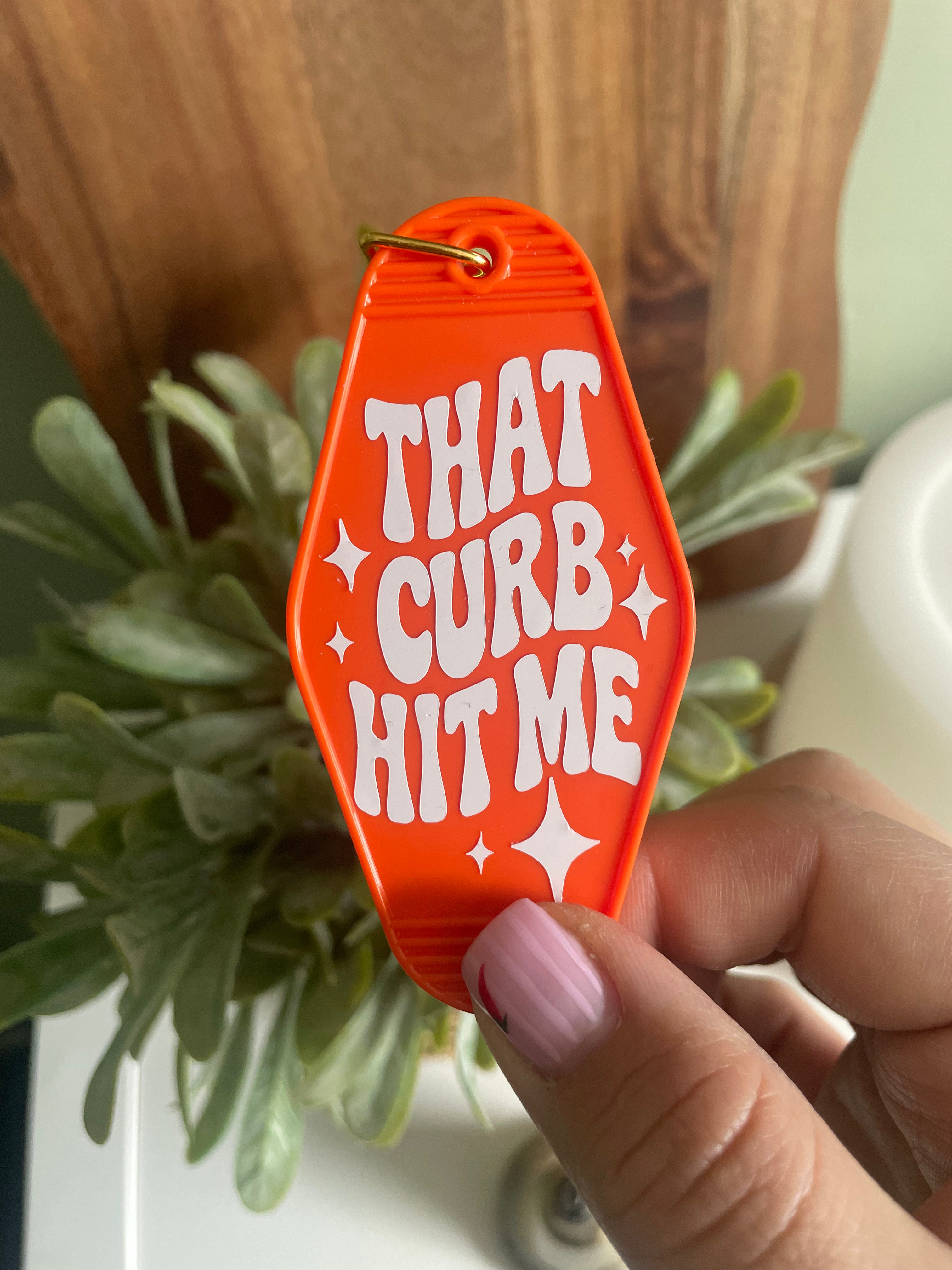 Sarcastic “That Curb Hit Me” Motel Keyring